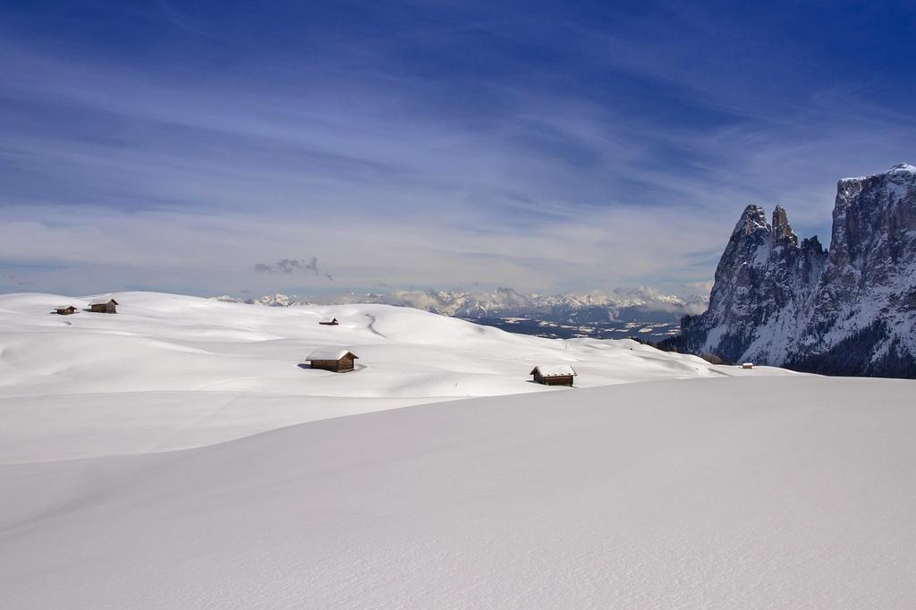Cloud infrastructure displayed on multiple digital screens with analytics